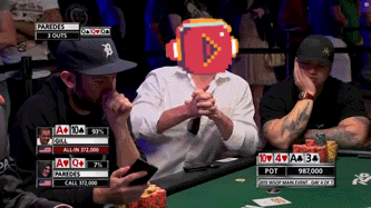 a man wearing headphones sits at a poker table with other men