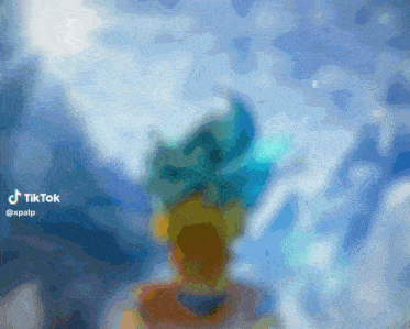 a blurred image of a person with a blue turban on their head with the hashtag tiktok at the bottom
