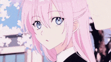 a close up of a pink haired anime girl with blue eyes .