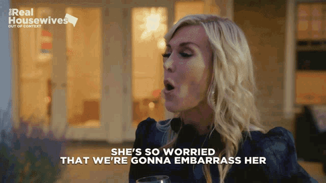 a woman says she 's so worried that we 're gonna embarrass her while holding a wine glass