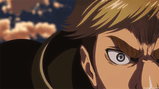 a close up of a man 's face with a blue eye and a cloudy sky in the background