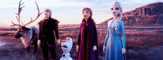 a group of cartoon characters are standing next to each other in a field with a reindeer .