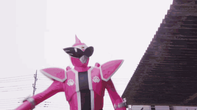 a pink superhero is standing in front of a pyramid