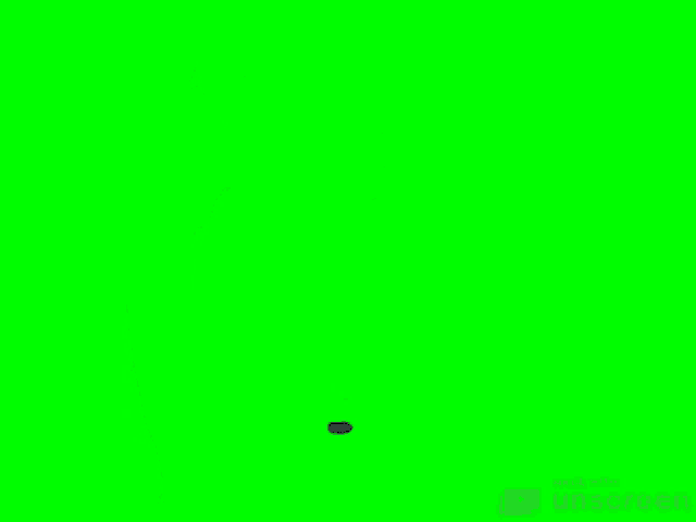 a man in a blue jacket and red pants is holding an lg laptop on a green screen