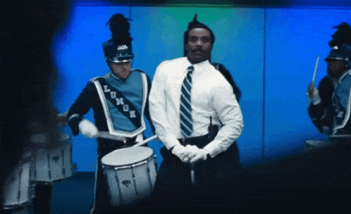 a man playing drums in a marching band with the word lom04 on their uniform
