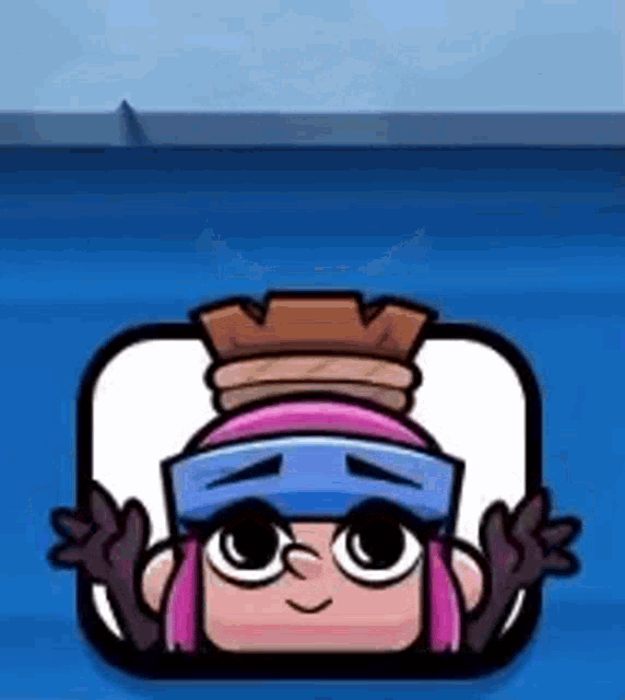 a cartoon character wearing a crown and glasses is sitting on a blue surface .