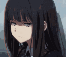 a close up of a girl with long black hair