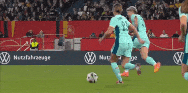 a soccer player wearing number 23 is kicking a ball