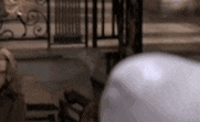 a blurred image of a person standing in front of a door .