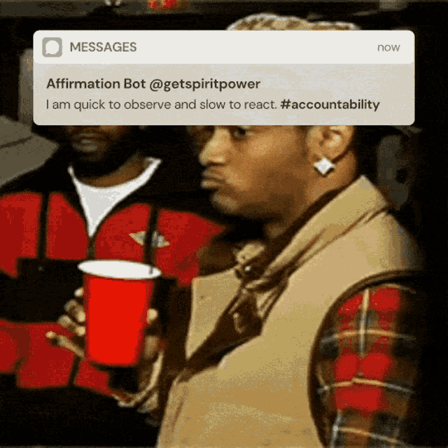 a man holding a red cup with a notification that says affirmation bot