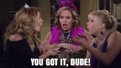 three women are talking to each other and one of them is holding a cell phone and says `` you got it dude '' .