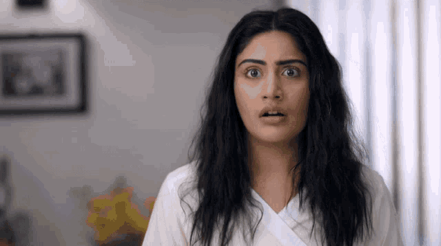 a woman making a surprised face with her mouth open