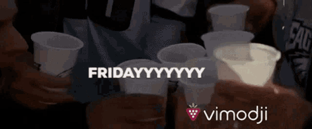 a group of people toasting with plastic cups with the words friday written on them