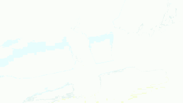 a blurred image of a person 's hand reaching out towards the ocean