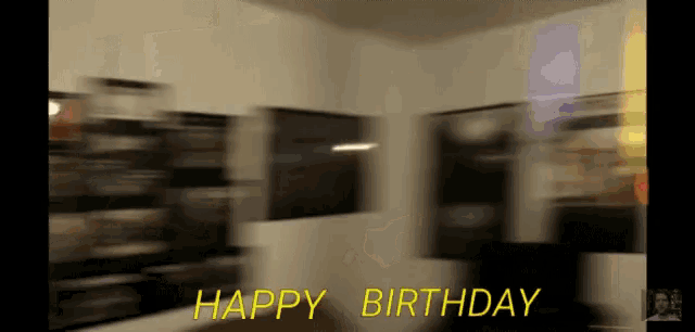 a blurry picture of a room with the words happy birthday written in yellow
