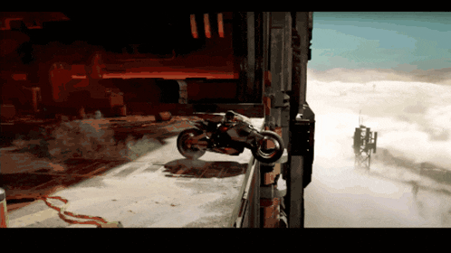 a person riding a motorcycle on top of a building in a video game