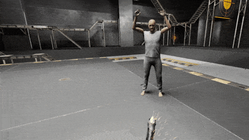 a man in a white shirt is standing on a gray floor