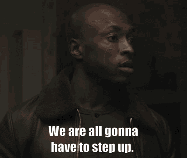 a man in a black jacket says we are all gonna have to step up