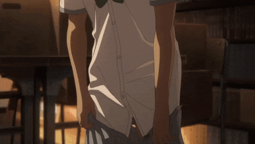 a man in a white shirt and tie is taking off his shirt