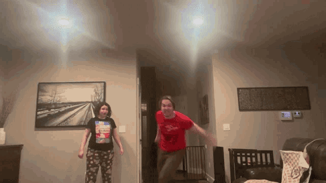 a girl wearing a shirt that says ' spiderman ' on it
