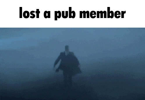 a man in a suit and tie is walking through a foggy field with the words lost a pub member above him .