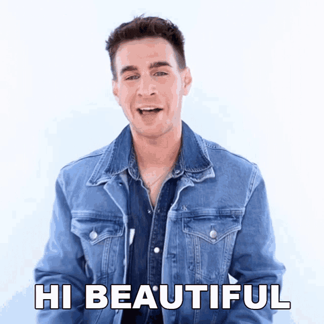 a man in a denim jacket says hi beautiful in white letters