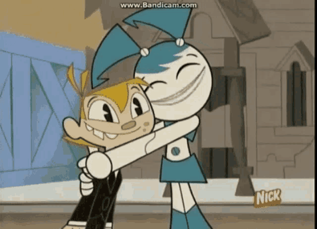 a cartoon of a boy and a girl hugging with the nick logo on the bottom right
