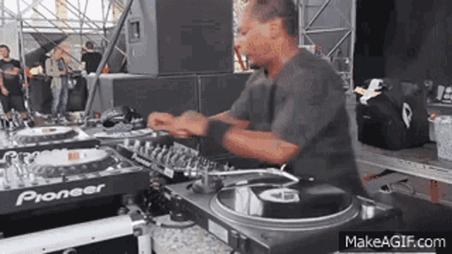 a man is playing music on a turntable that says pioneer
