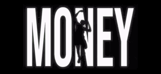 a man is standing in the shadows of the word money