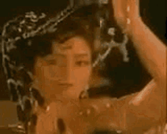 a close up of a woman 's face in a mirror .