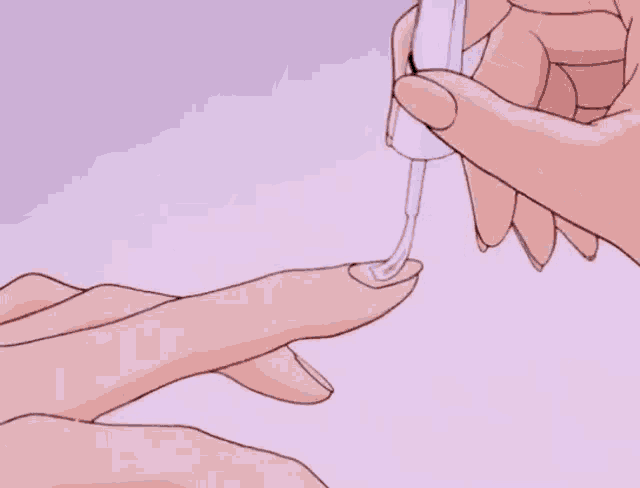 a person applying nail polish to another person 's finger