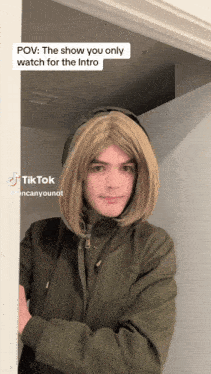 a man in a wig is standing in a doorway with a caption that says pov the show you only watch for the intro on it