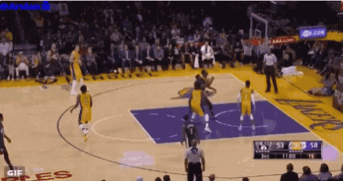 a basketball game is being played in front of a crowd with the word gif on the bottom left