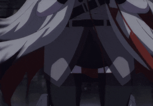 a close up of a person 's pants with a red stripe on the bottom