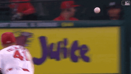 a blurred image of a baseball player in front of a jupiter ad