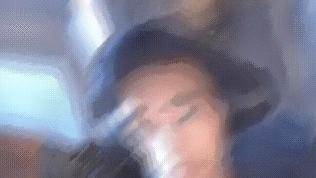 a blurry picture of a woman wearing a hat