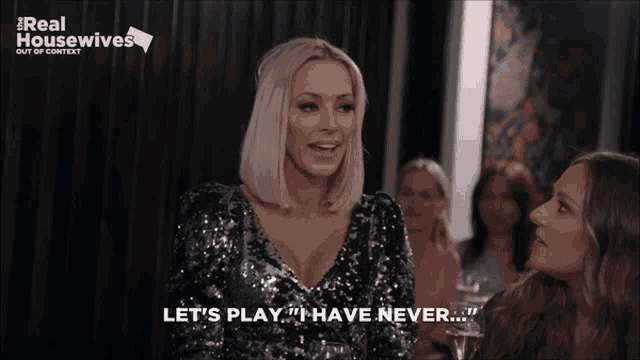 a woman in a sequined dress says let 's play " i have never "