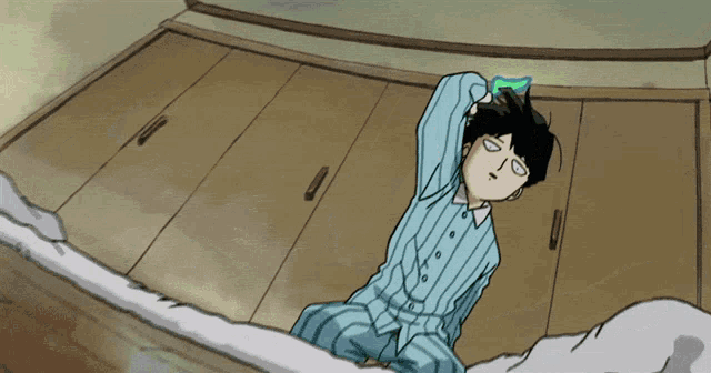 a cartoon character in a blue and white striped shirt is laying on the floor