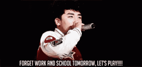 a man is singing into a microphone with the words forget work and school tomorrow let 's play written below him