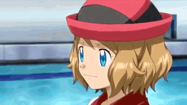 a pokemon girl wearing a red hat is standing next to a pool .
