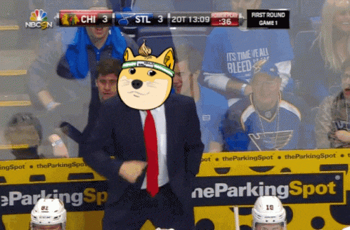 a man in a suit and tie is dancing in front of a nbc n logo