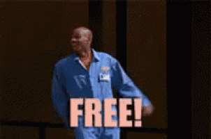 a man in a blue suit is standing with his arms outstretched and says free !