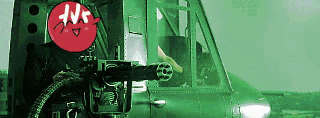 a green helicopter has a red circle with the letter n on it