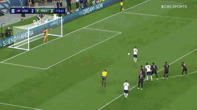 a shirtless soccer player with the number 10 on his shorts is kicking a soccer ball