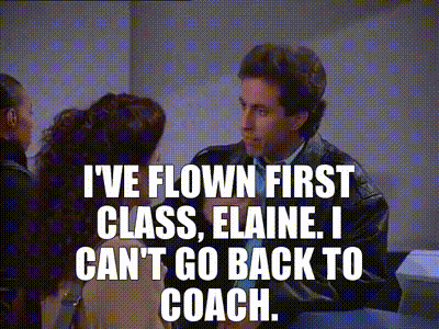 a man is talking to a woman and says i 've flown first class , elaine .