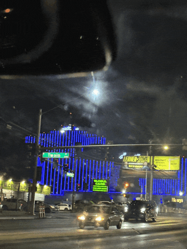 a billboard for lerner 's juice hangs over the intersection