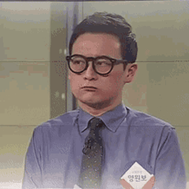 a man wearing glasses and a name tag that says ' yongwonbo ' on it