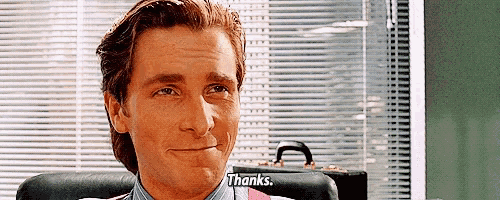 a man sitting in a chair with a briefcase in front of him says thanks