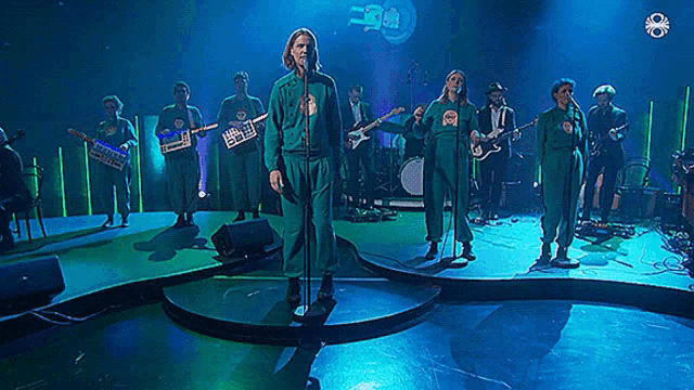 a group of people standing on a stage with a sign that says 30