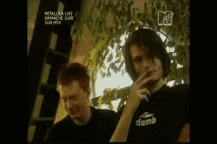 two men are standing next to each other with the word ba in white letters